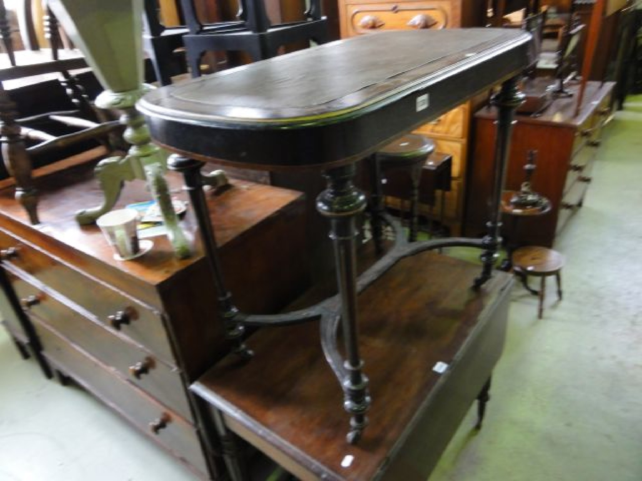 Appraisal: A Victorian ebonised occasional table of rectangular form with rounded