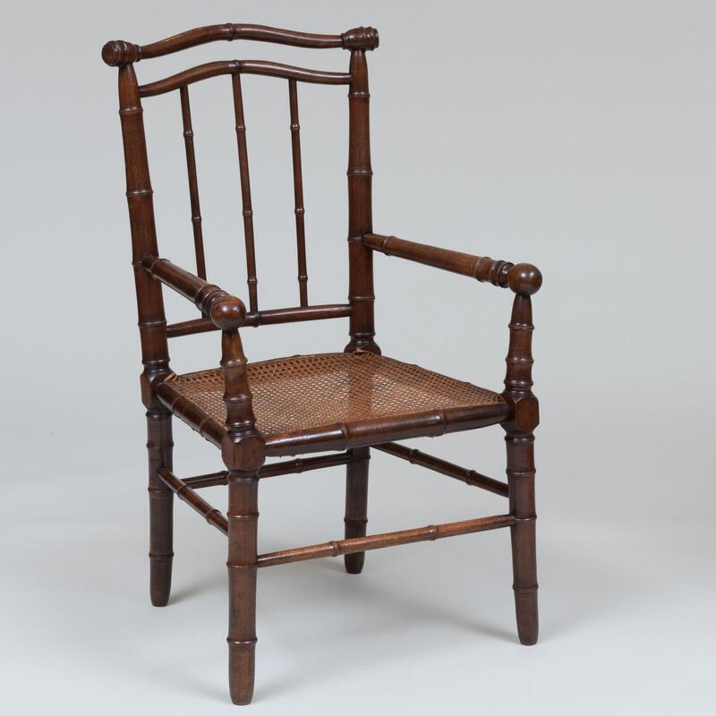 Appraisal: Faux Bamboo Stained Wood and Caned Armchair Fitted with a