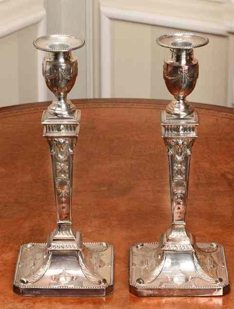 Appraisal: A PAIR OF ADAM STYLE SILVER CANDLESTICKS with ram's head