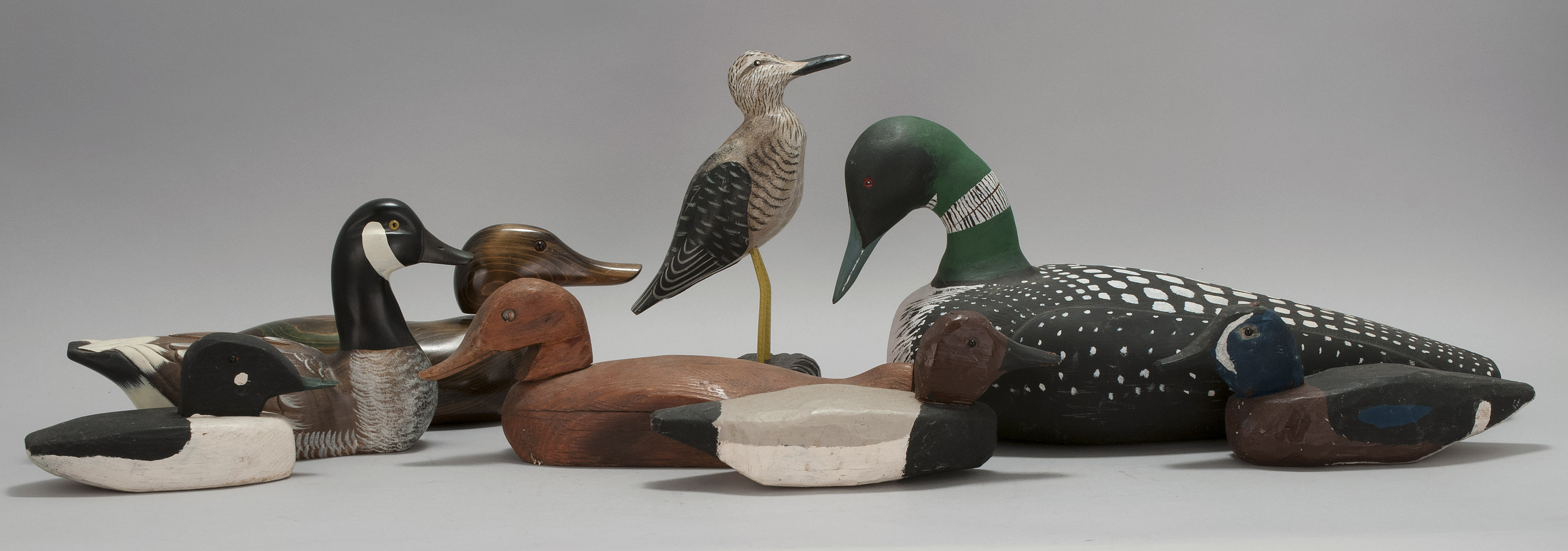 Appraisal: EIGHT CONTEMPORARY BIRD CARVINGSConditionFour decoys have dog chewed bills loon