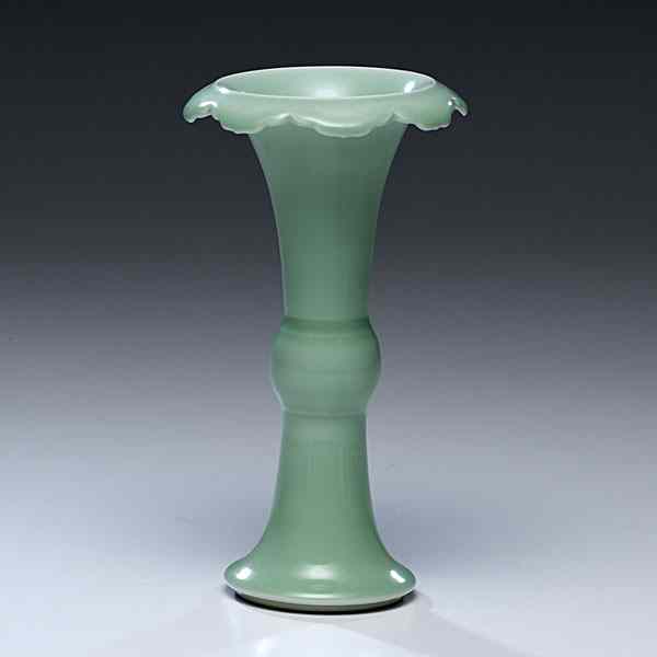 Appraisal: Chinese Celadon Gu Vase Chinese A Gu-form vase in a