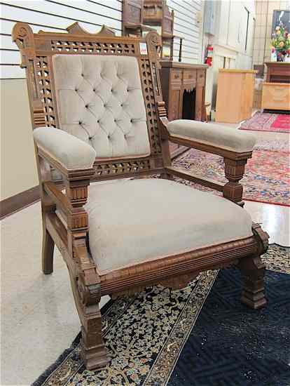 Appraisal: VICTORIAN WALNUT ARMCHAIR Eastlake design American c with padded back