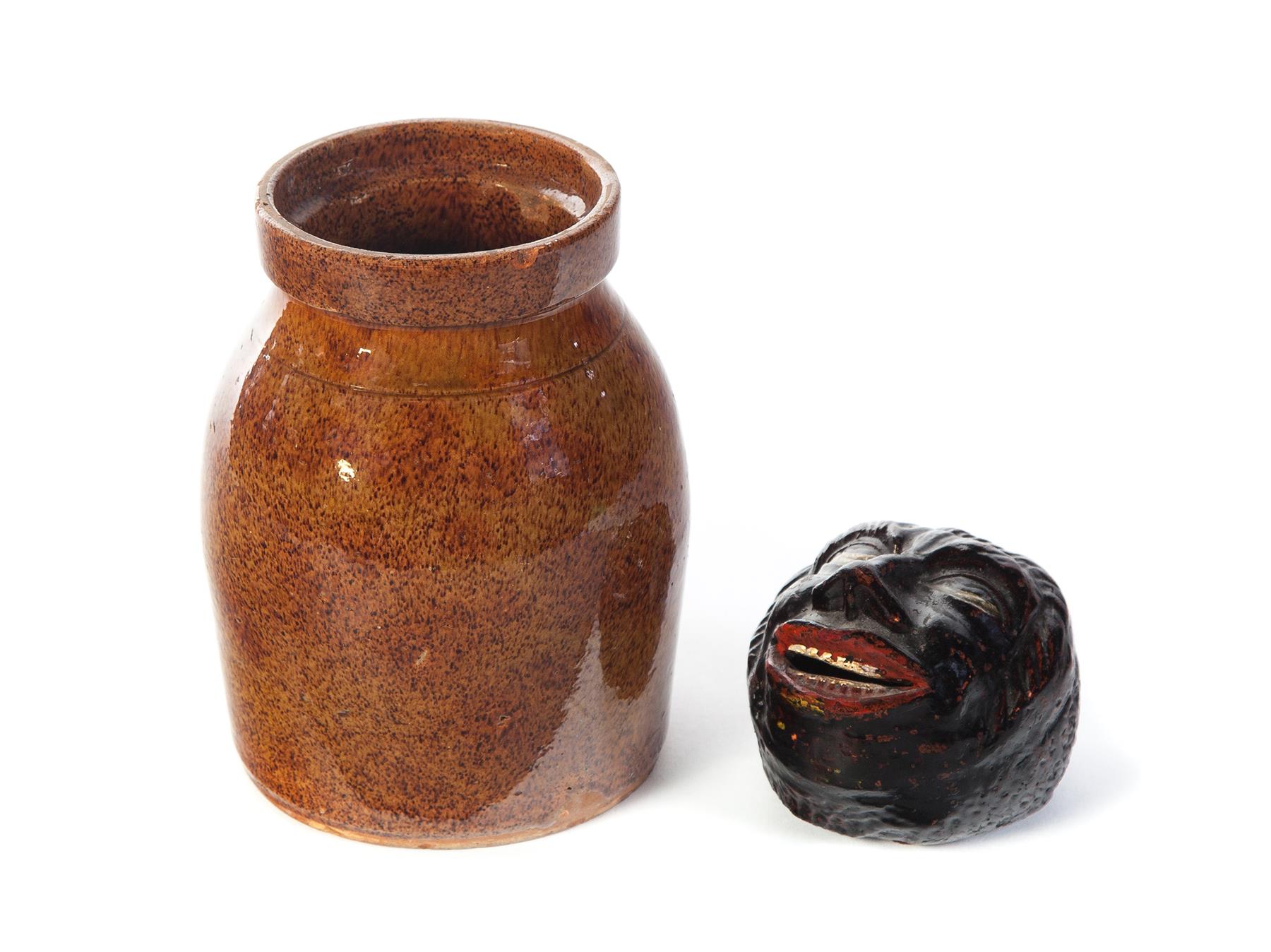 Appraisal: AMERICAN REDWARE JAR AND FOLK ART BANK Second half- th