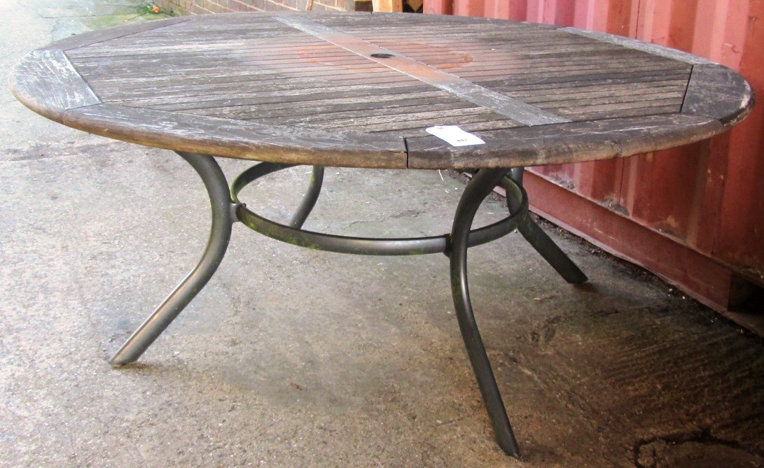 Appraisal: A th century circular slatted teak garden table on metal