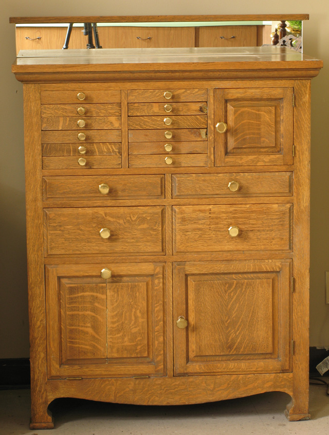 Appraisal: AN OAK DENTAL CABINET American early th century the front