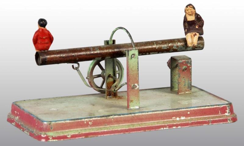 Appraisal: Tin Hand-Painted See-Saw Toy Description German Composition figures Some paint