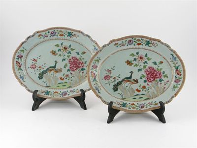 Appraisal: A pair of Chinese famille rose double peacock dishes typically