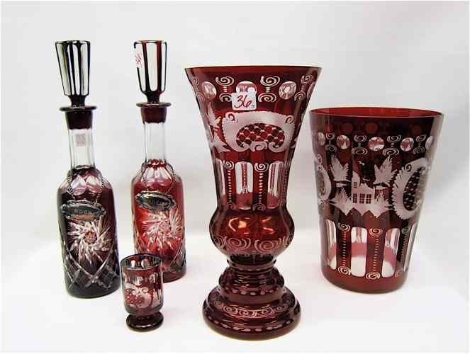 Appraisal: FIVE PIECES BOHEMIAN RUBY RED TABLEWARE flashed and cut patterns