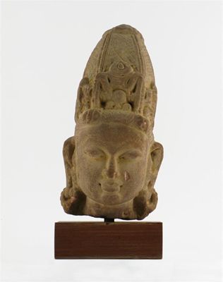 Appraisal: An Indian Pala red sandstone carved head of a female