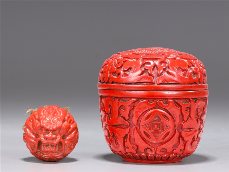 Appraisal: Chinese glass imitating coral toggle with dragon designs in cinnabar-like