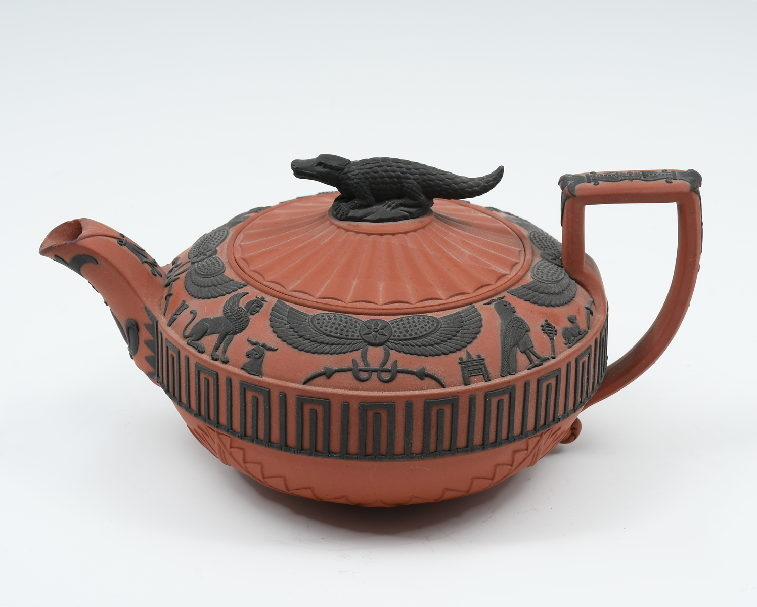 Appraisal: WEDGWOOD ROSSO ANTICO FIGURAL TEAPOT Wedgwood Rosso Antico Covered Teapot