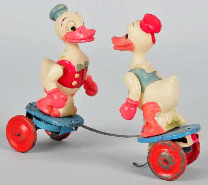 Appraisal: Celluloid Disney-Inspired Ducks Boxing Toy Description Wind-up mechanism is working