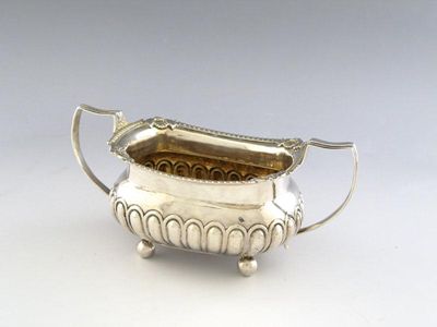 Appraisal: A George III two-handled silver sugar basin of rectangular form