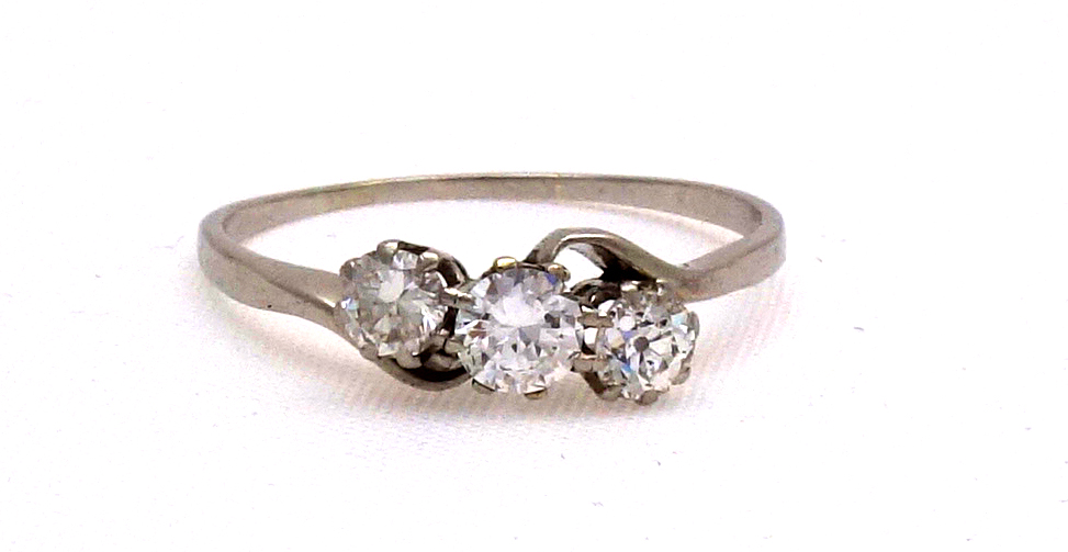 Appraisal: A diamond three stone cross-over ring the old-cut and two