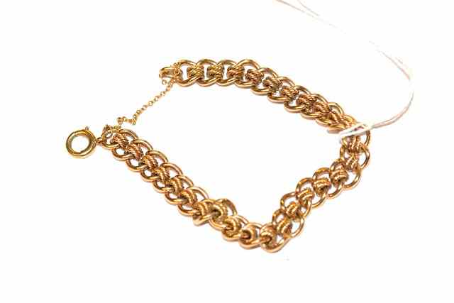 Appraisal: A CT GOLD CURB LINK BRACELET with attached twisted links