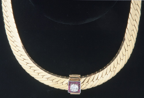 Appraisal: Wide k yg necklace with detachable diamond and ruby enhancer