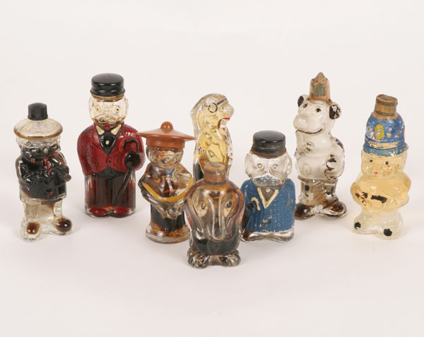 Appraisal: Figural bottles include four animals and four characters including sailor