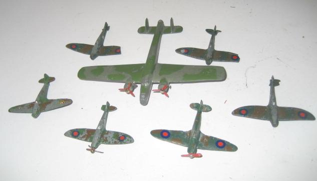 Appraisal: A Whitley bomber four Spitfires and two Hurricanes some damage