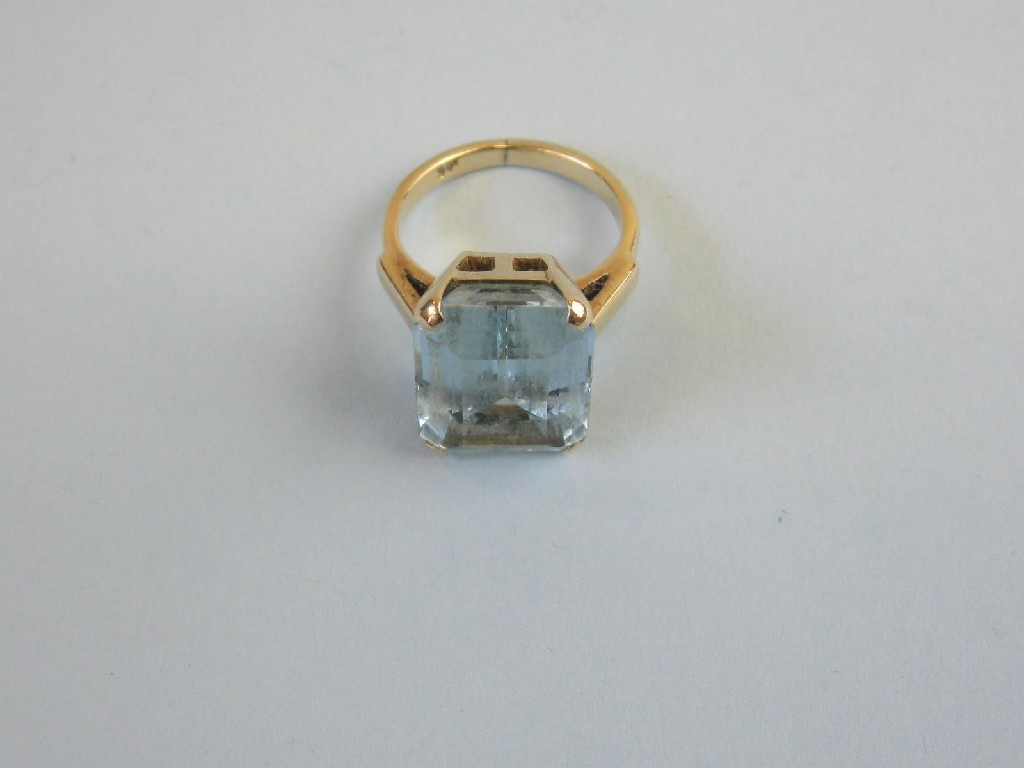 Appraisal: An Aquamarine Dress Ring the large step-cut stone claw-set in