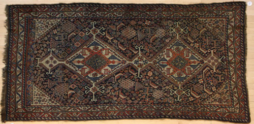 Appraisal: Akstafa design carpet ca with two medallions on a navy