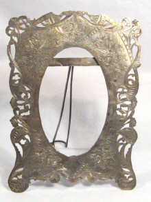 Appraisal: A hallmarked Persian silver oval portrait frame with strut back