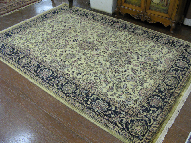 Appraisal: HAND KNOTTED ORIENTAL CARPET Indo-Persian overall floral decoration on moss