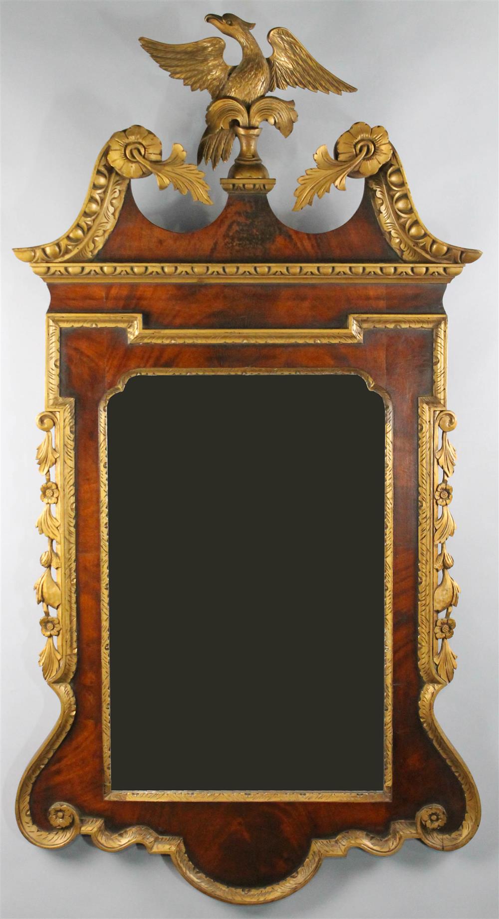 Appraisal: GEORGE III STYLE MAHOGANY AND GILTWOOD MIRROR eagle atop broken