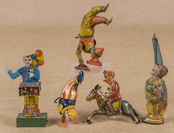 Appraisal: Four tin litho wind-up clowns to include a Germa Four