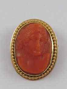 Appraisal: A carved coral cameo mounted as a brooch in yellow