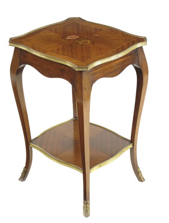 Appraisal: A French mahogany serpentine two tier stand