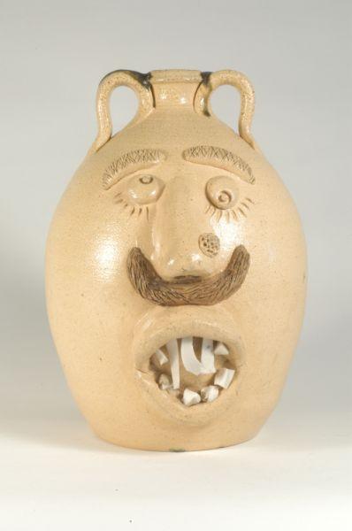 Appraisal: Signed D B Garner Salt glazed stoneware double face jug