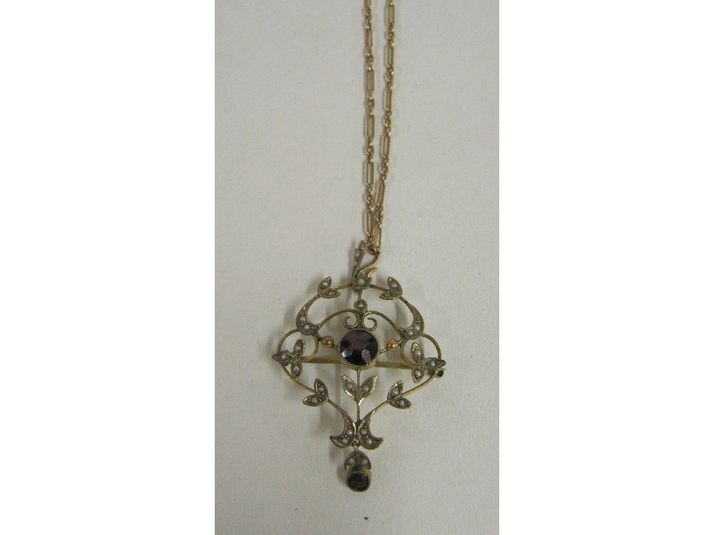 Appraisal: Edwardian ct gold garnet and seed pearl set pendant brooch