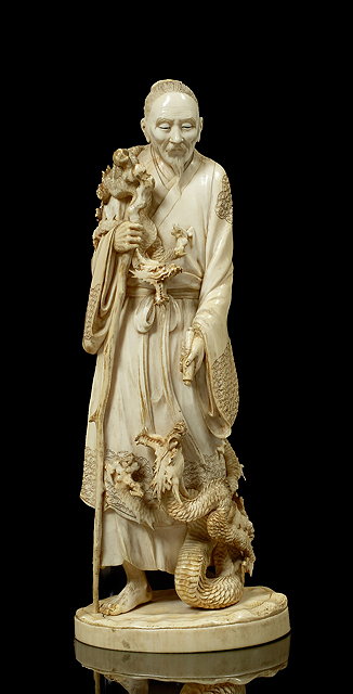 Appraisal: A Japanese ivory okimonoMeiji period - of a standing Immortal