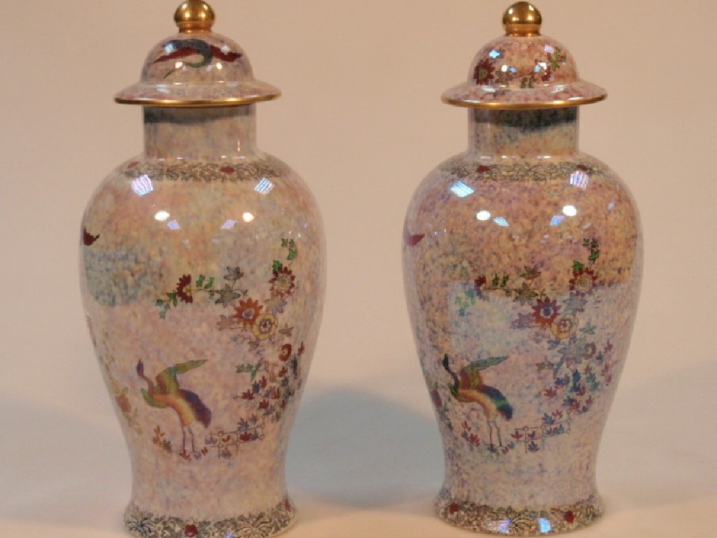 Appraisal: A pair of Wilton ware baluster vases and covers decorated