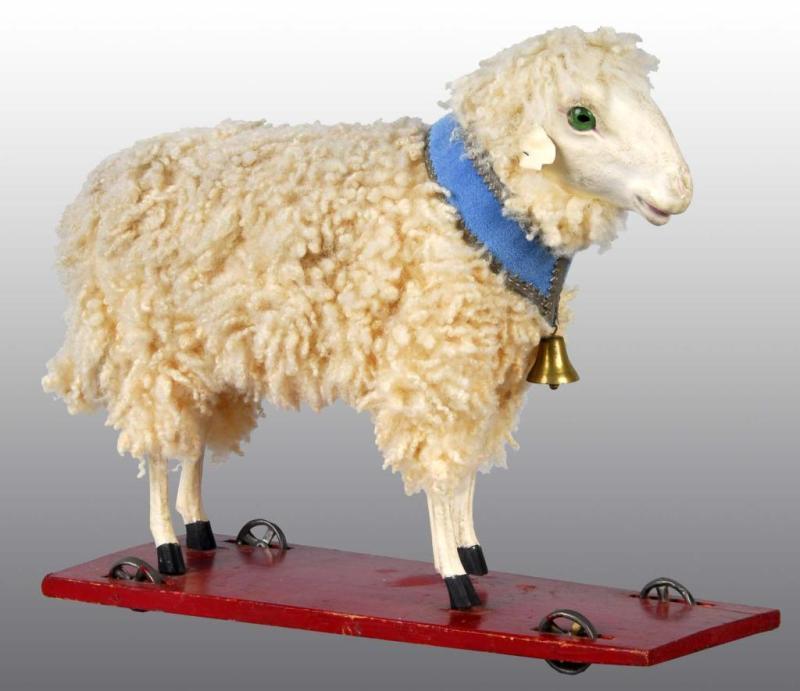 Appraisal: Large Sheep Pull Toy with Dresden Collar Description All original