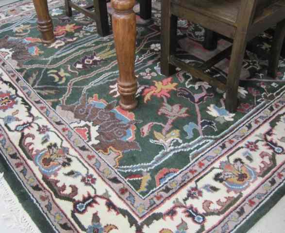 Appraisal: HAND KNOTTED ORIENTAL CARPET Indo-Persian Arts Crafts influence the hunter