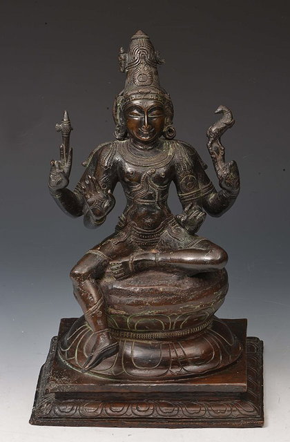 Appraisal: AN INDIAN BRONZE FIGURE OF VISHNU seated in lalitasana upon