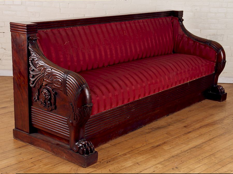 Appraisal: CARVED EMPIRE STYLE MAHOGANY SOFA CIRCA A carved Empire style