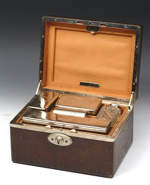 Appraisal: A TRAVELLING BOX the fitted interior with silver plated and