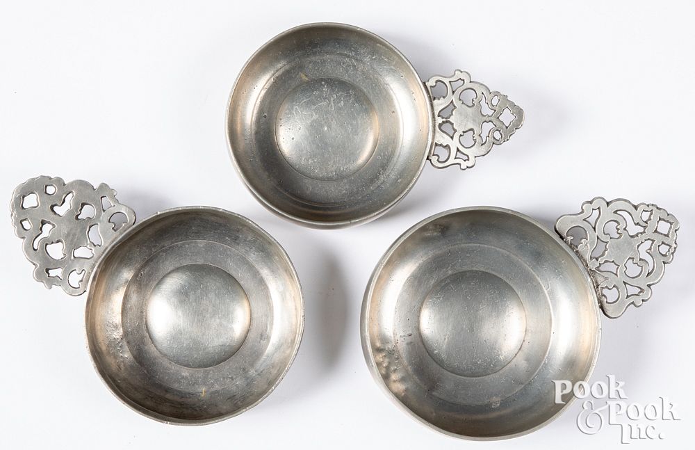 Appraisal: Three New England pewter porringers th c Three New England