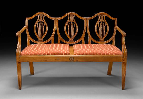 Appraisal: An Italian Neoclassical walnut settee late th century The shaped