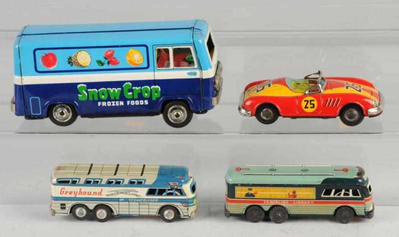 Appraisal: Lot of Tin Vehicle Friction Toys Description Japanese Working Includes