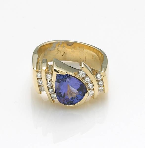 Appraisal: A tanzanite diamond and k gold ring centering a pear-shaped