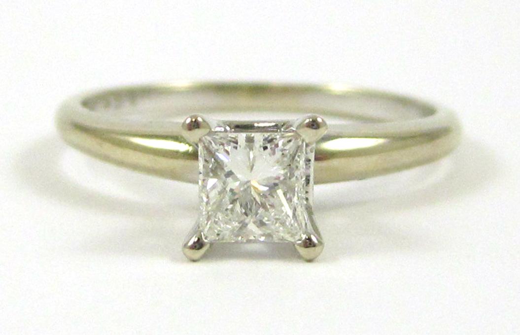 Appraisal: DIAMOND AND FOURTEEN KARAT GOLD SOLITAIRE RING The white gold