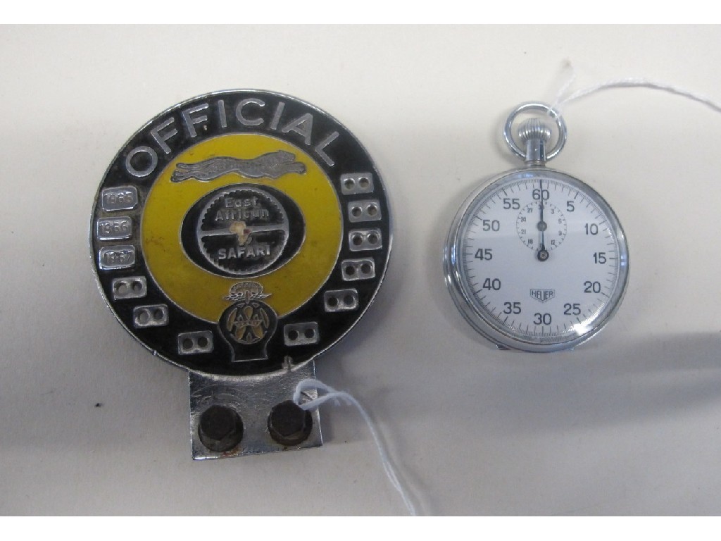 Appraisal: East African Safari car badge and a Heuer stopwatch