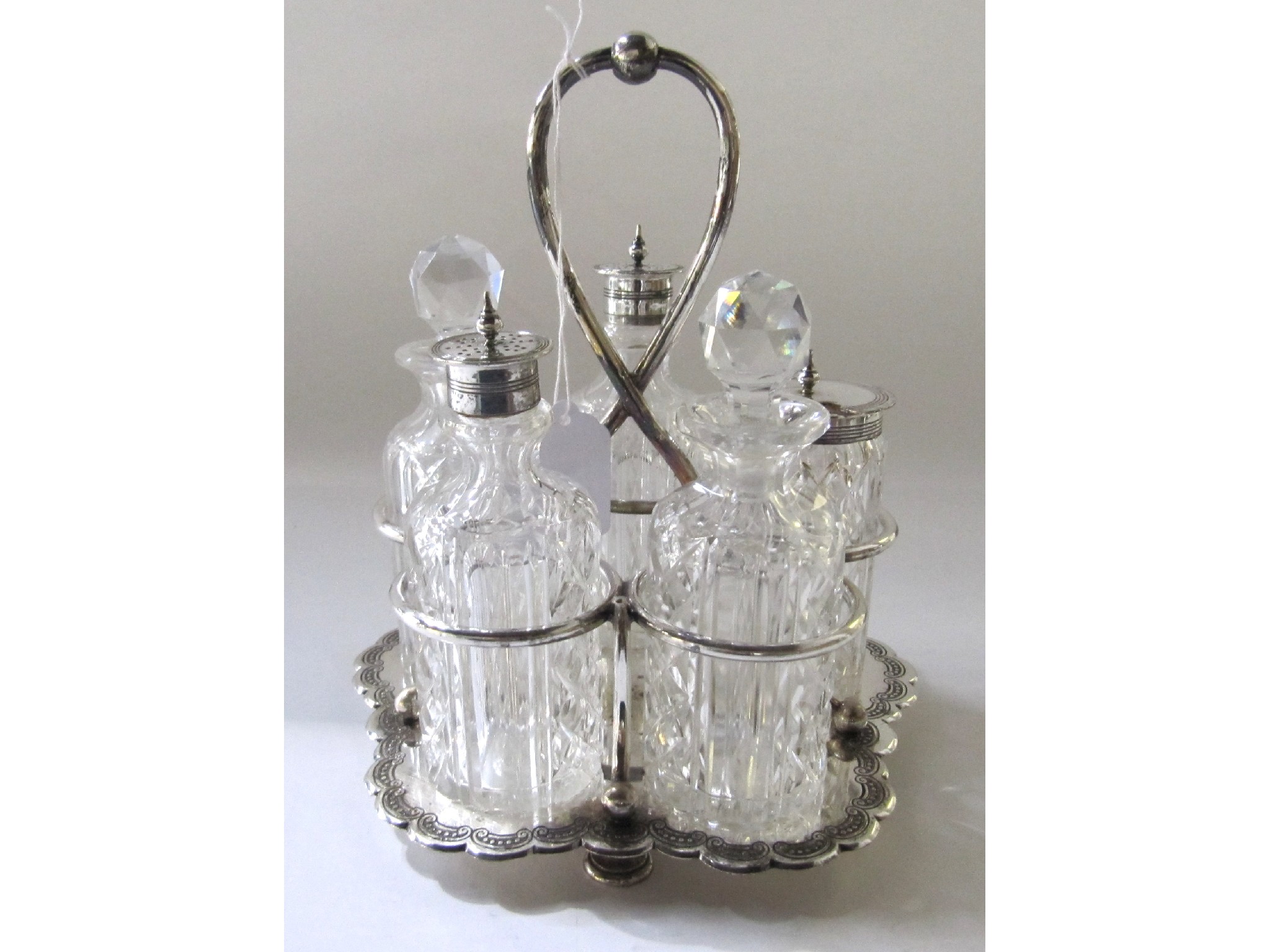 Appraisal: A silver plated four-bottle cruet stand