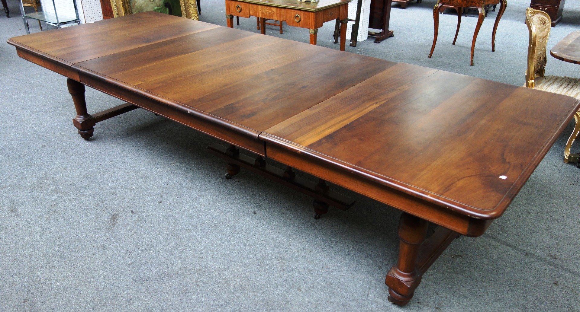 Appraisal: A th century style French walnut extending dining table with