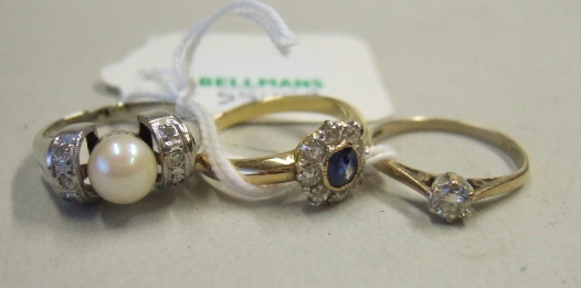 Appraisal: A gold sapphire and diamond set nine stone cluster ring