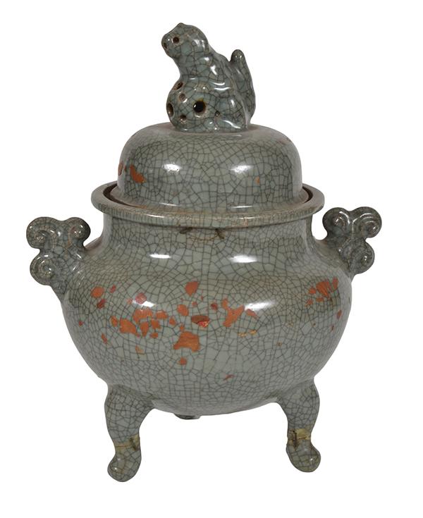 Appraisal: A LARGE CHINESE CELADON-GLAZED TRIPOD CENSER AND COVER WITH BUDDHISTIC