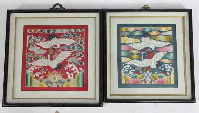 Appraisal: A pair of Chinese embroidered panels depicting cranes in flight